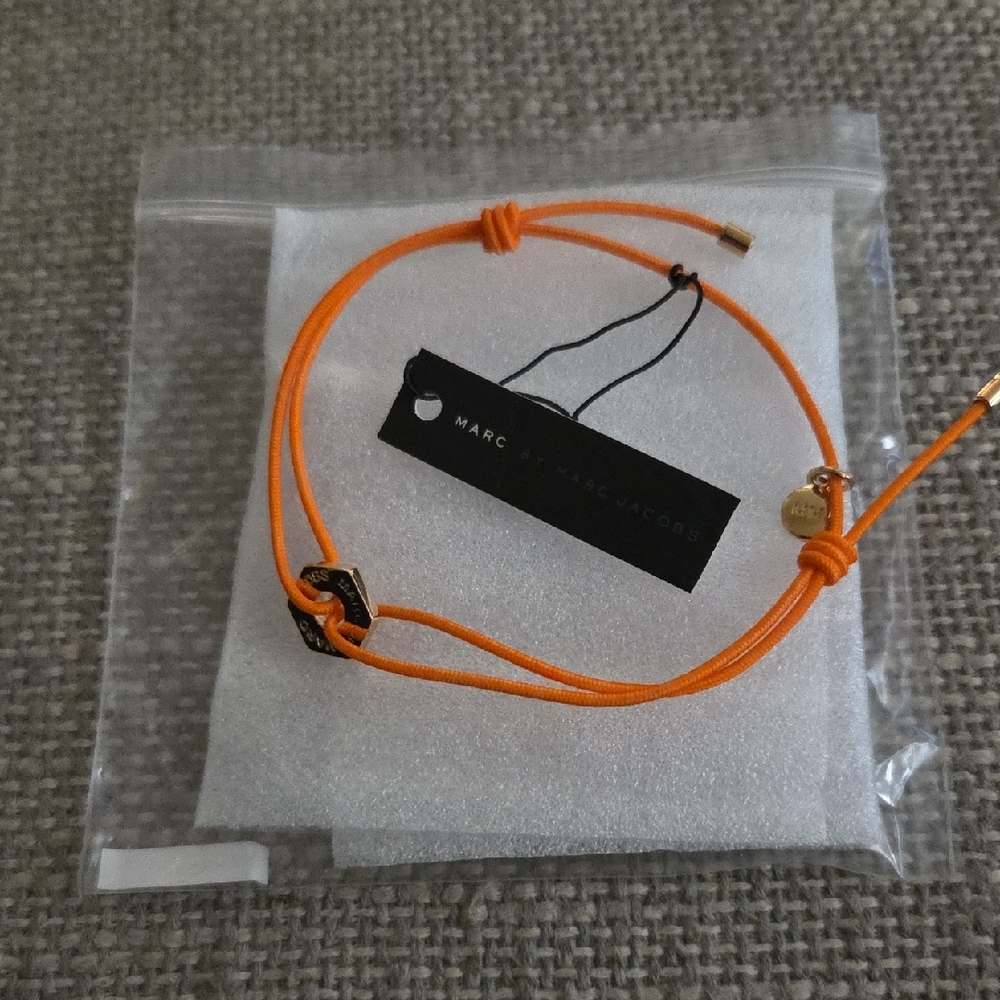 Marc Jacobs Vibrant Orange Bracelet with Gold Charm